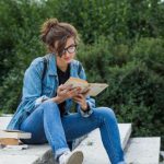 woman reading on steps