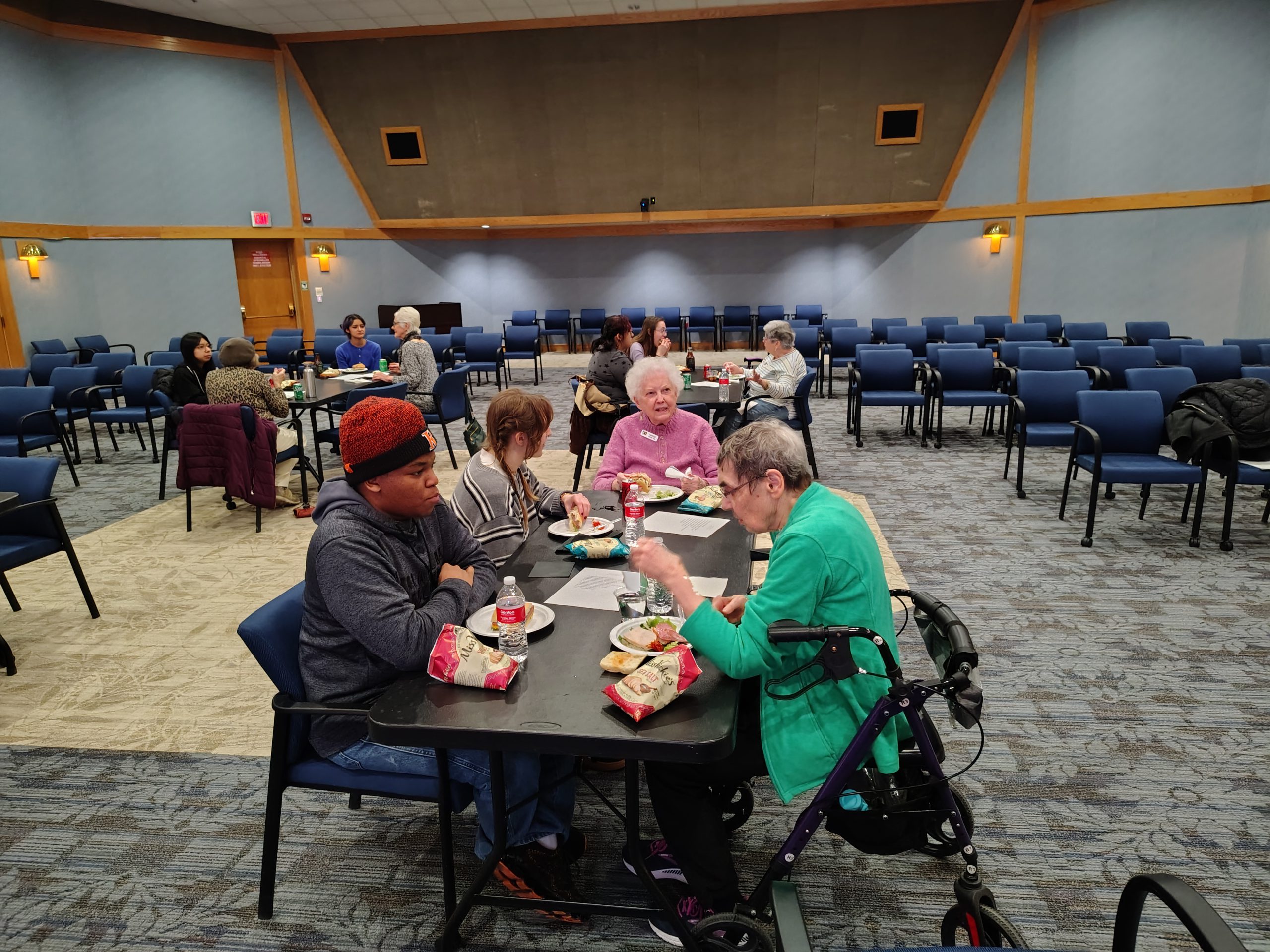 students and seniors snacking and chatting